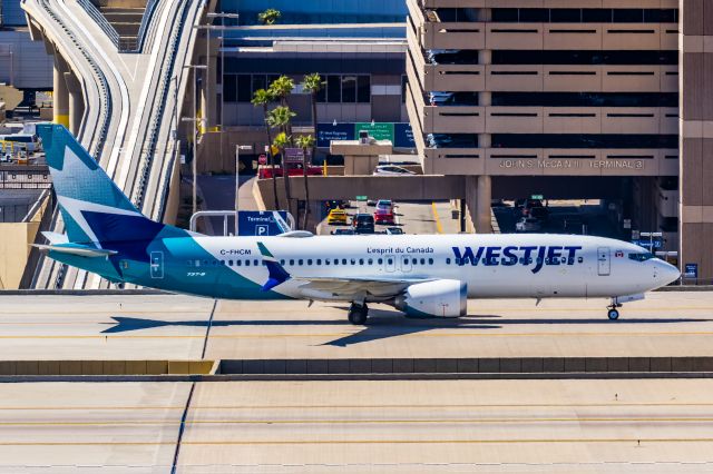 Boeing 737 MAX 8 (NF-HCM) - A WestJet 737 MAX 8 taxiing at PHX on 3/4/23. Taken with a Canon R7 and Canon EF 100-400 L II lens.