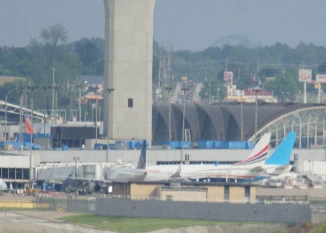 Boeing 737-800 (N917XA) - Two Xtra Airways 737s, N917XA and N881XA, board passengers in St. Louis.