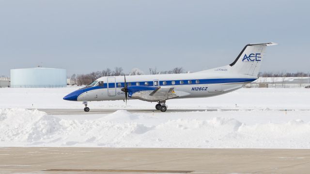 Embraer EMB-120 Brasilia (N126CZ) - A E120 Freight Runners Express taxi's in past all the snow built up at KVPZ.