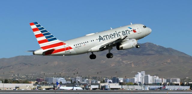 Airbus A319 (N827AW) - Just off 34R and on the climb enroute to Dallas.