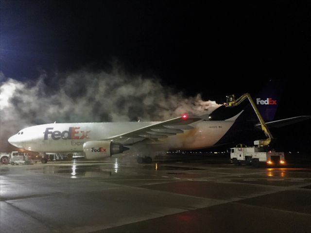 Airbus A300F4-600 (N665FE) - Some early season deicing at Appleton International Airport.br /br /32 F and some mid November ice & snow build up on the fuselage and wings.