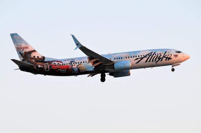 Boeing 737-900 (N570AS) - Disney Cars themed aircraft landing 23-R at KIND at Sunset.