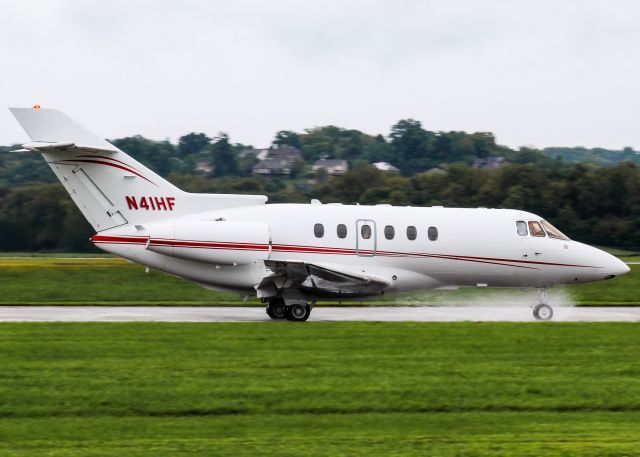 Hawker 800 (N41HF) - A Hawker 800 powers through the rain.