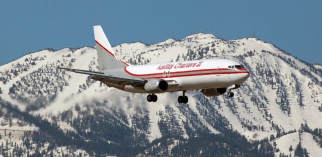 BOEING 737-400 (N730CK) - A KFS B734 (N730CK) glides past snow-capped Slide Mountain while on final to runway 34L to complete a morning KLAX-KPHX-KRNO run.  Kalitta Charters IIs only 737 visits Reno every weekday morning and spends the midday hours here.  It departs in late afternoon.