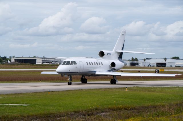 Dassault Falcon 50 (N77ME) - Taxing to runway 5