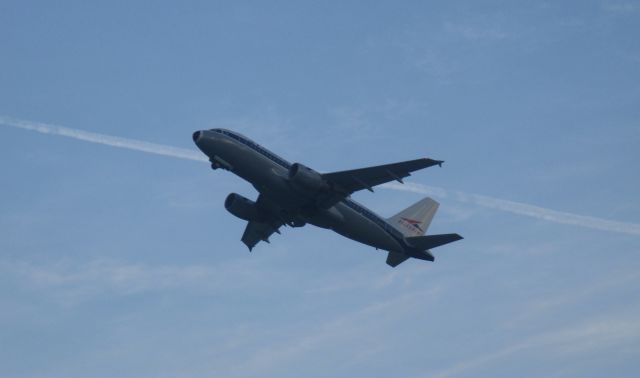 Airbus A319 (N745VJ) - Vistajet climbing into a deep blue evening sky at CLT.