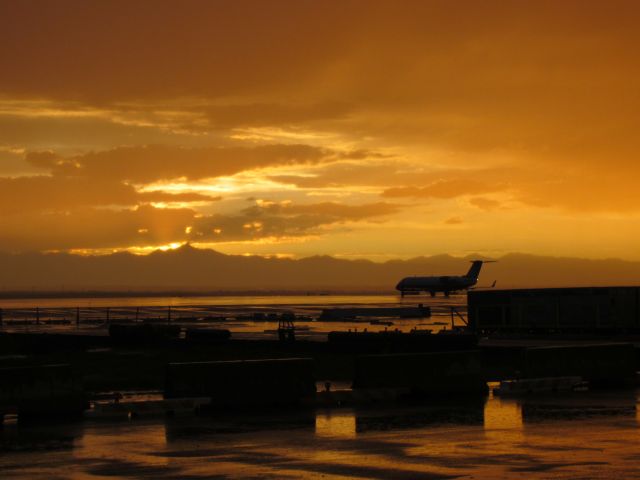 Canadair Regional Jet CRJ-700 — - This shot is after a monsoon went thru KDEN and 3 in of rain. Monsoon moved out just at sunset !