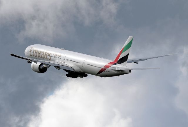 BOEING 777-300ER (A6-ENK) - EK18 off into cloudy skies.