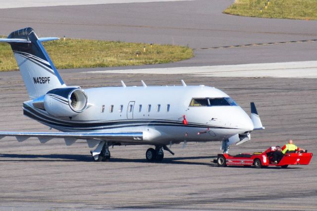 Canadair Challenger (N426PF) - Privately owned 2002 Challenger 600 being towed across the Signature Flight Support ramp at KTPA on 12-11-2020