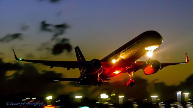 — — - American airlines departing TNCM St Maarten at sunset!