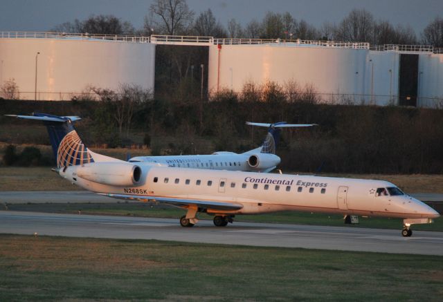 Embraer ERJ-145 (KCLT) - Who are we? We look the same, but we display two different names. - 3/18/11