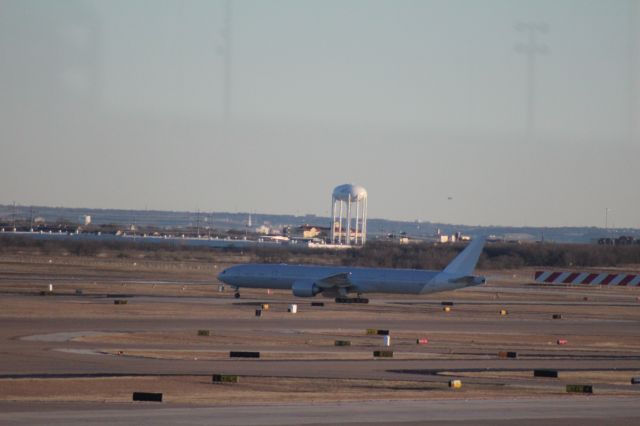 BOEING 777-300ER — - 013013 AA B777-300ER taxing in to the east hanger for final paint