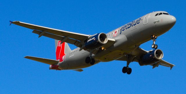 Airbus A320 (N605JB) - Jet Blue on final on Rafael Hernandez Airport, March 20,2013.