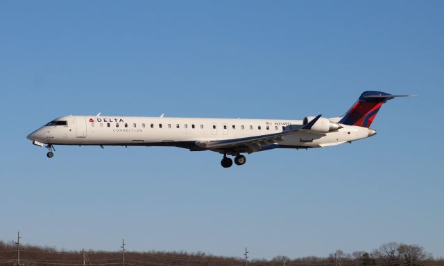 Canadair Regional Jet CRJ-900 (N314PQ) - A Bombardier CRJ-900LR in Delta Connection livery approaching touchdown on Runway 36R at Carl T. Jones Field, Huntsville International Airport, AL - December 30, 2016. Shot from outside the taxiway perimeter fence using a Canon T5 in sports mode, with the 75mm-300mm lens.