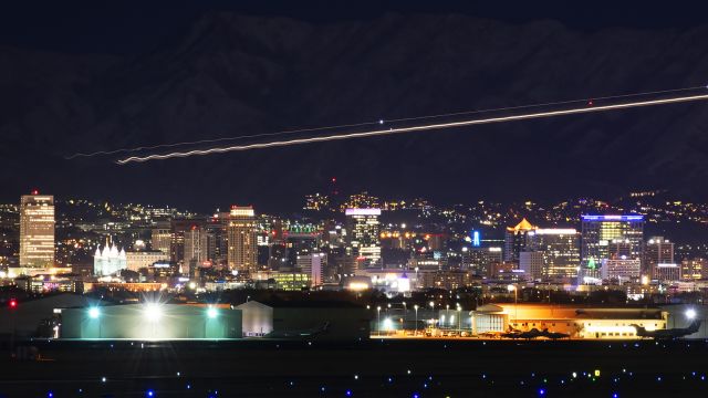 Gulfstream Aerospace Gulfstream 3 (N62MV) - Departing past the SLC skyline.