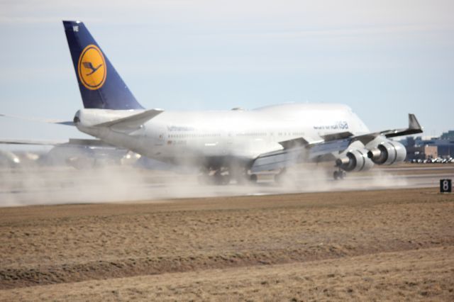 Boeing 747-400 (D-ABVE) - Reverse thrust kicks dust in to the air upon landing at DIA.