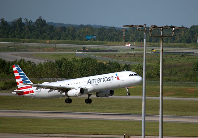 Airbus A321 (N545UW) - AAL N545UW taking off on Rwy 36C at KCLT.  Photo taken from the hour parking deck with a Nikon D5500 and 300mm lens