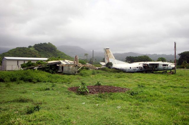 Antonov An-26 — - More than 15 years after the US intervention on Grenada, the Cubana Airlines An-2 and An-26 captured at Pearls Airfield are still there!