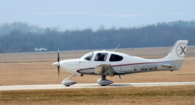 Cirrus SR22 Turbo (C-GDGN) - Taxiing to parking is this 2011 Cirrus SR22-X Turbo in the Winter of 2023.