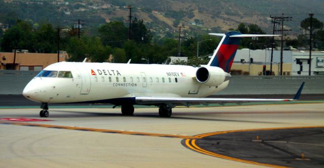 Canadair Regional Jet CRJ-200 (N910EV) - Awaiting departure to KSLC, sitting behind SWA # 3506 at Rwy 15