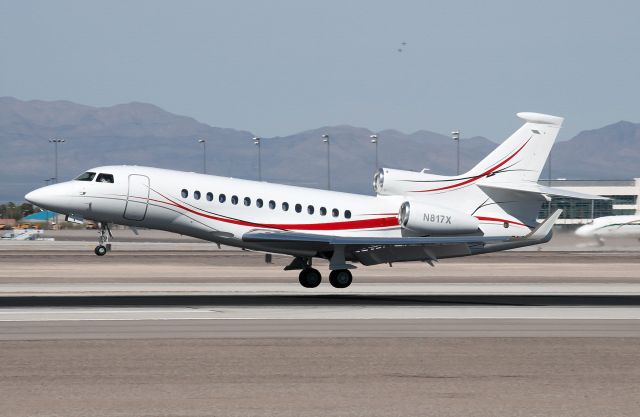 Dassault Falcon 7X (N817X) - A TP Aviation Falcon 7X coming in to land. A pair of A-10 Warthogs flying over Nellis AFB can be seen in the distance.