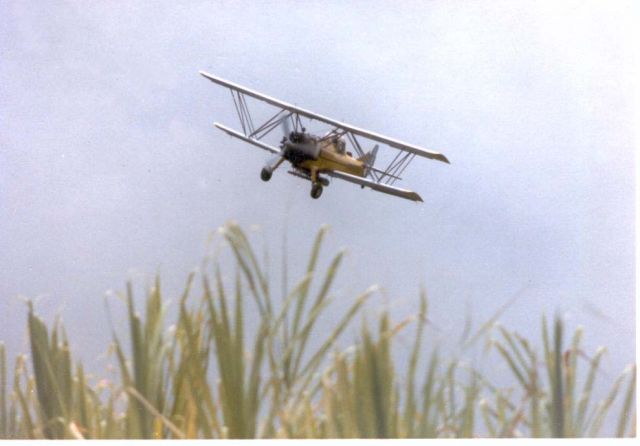 N88899 — - Taken above Hilo, HI in the late 1970s.  We used to like to watch the Murray Air crop dusters work the sugar cane fields.  When those pilots knew we were watching they would hot dog it even more!