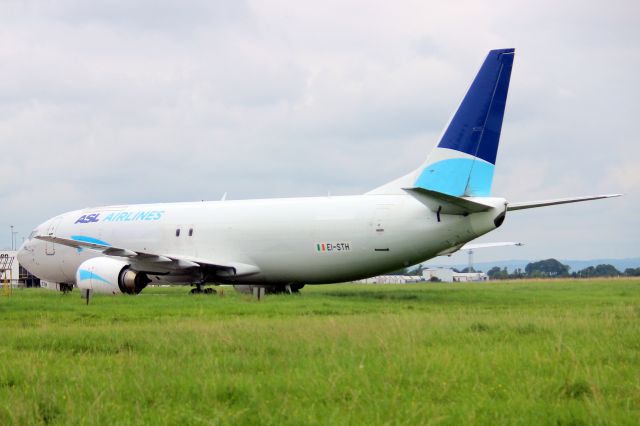BOEING 737-400 (EI-STH) - Parked on the on cargo ramp on 30-Aug-21 one week prior to returning to service with its Irish registration.
