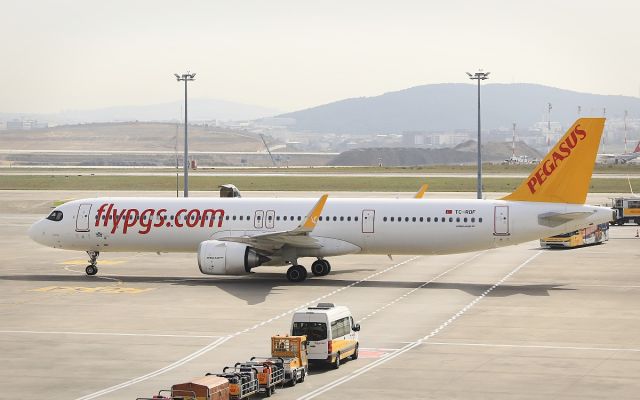 Airbus A321neo (TC-RDF) - Taken from inside terminal building. Plane gets ready to taxi to runway to depart.