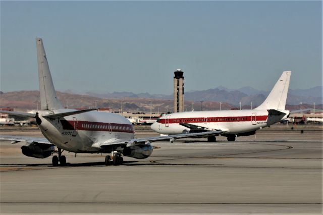 Boeing 737-200 (N5294M) - KLAS some heat haze on this photo__2 JANET Flight 737-200s at Runway 1L N5294M set to depart for Area 51 or Tonopah, this jet delivered to the USAF as 72-0287 and is LN 343. WFU at DMA Jan 2009.