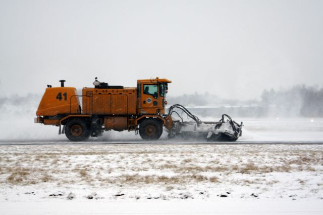 — — - Removing snow during todays snow storm