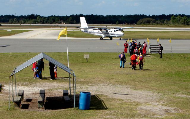 — — - Skydivers preparing to board N24HV DHC twin Otter at Deland , Florida