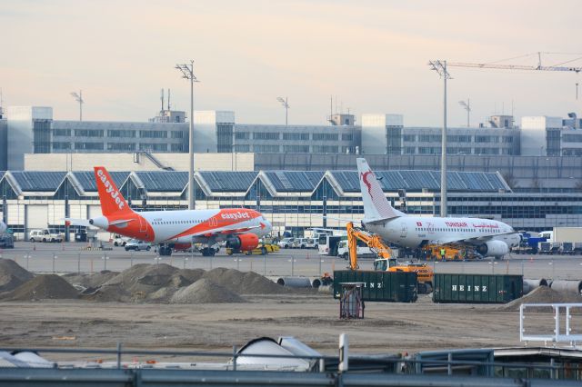 BOEING 737-600 (TS-IOR) - Apron Terminal 2, construction work in progress