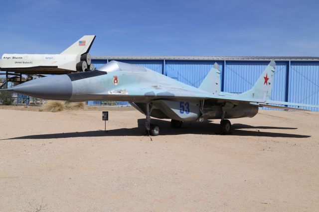 MIKOYAN MiG-33 (UNKNOWN) - Mikoyan Gurevich MiG-29 Fulcrum-A at Pima Air and Space Museum, Tucson, AZ, 17 May 14.  From the PASM website:br /br /Manufacturer: MIKOYAN-GUREVICHbr /Markings: Soviet Air Force, ca. 1990br /Designation: MIG-29br /Serial Number: Unknownbr /br /MIKOYAN-GUREVICH MIG-29 FULCRUM-Abr /br /Development of the MiG-29 began in the late 1960s to meet the Soviet Unions requirement for a modern small tactical fighter to replace the MiG-21. The aircraft that emerged in 1977 proved to be a more than worthy successor. Flight testing was still underway in 1982 when the first production aircraft were rushed off the assembly line to match the latest generation of American fighters the F-16 and F/A-18. Like its predecessor the MiG-21 the Fulcrum was widely exported by the Soviet Union with nearly thirty countries using the export version of the MiG-29. The exported aircraft were not as capable as the ones built for Soviet use. They have a less capable radar and lack the ability to drop nuclear weapons. This aircraft was built for the Soviet Air Force and had full electronic and weapons capabilities.