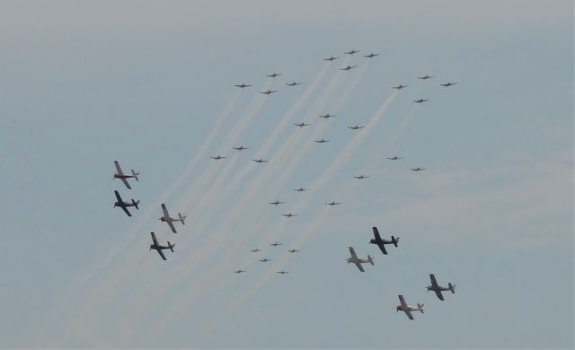 — — - Amazing opportunity to see this! 32 aircraft in the background, 8 in the front for a total of 40. Took the shot while waiting to ride in the Ford Trimotor.