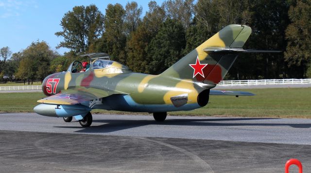 PZL-MIELEC SBLiM-2 (NX157GL) - Left quarter rear view of the Polish-built Mikoyan Gurevich MiG-15 UTI, owned by Red Star Aero, taxiing towards the ramp during Aviation Career Day 2022 at St. Clair County Airport, Pell City, AL - October 8, 2022.