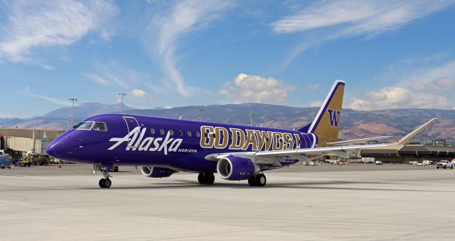 EMBRAER 175 (long wing) (N662QX) - Taxiing away from Concourse C and headed for Taxiway Alpha, QXE's collegiate University of Washington Huskies livery "Go Dawgs" passes my spotting position on November ramp.