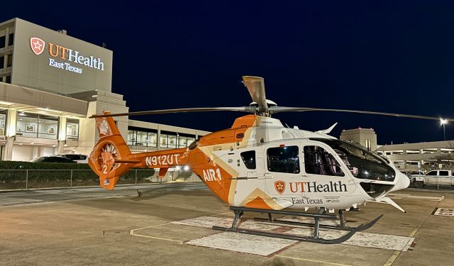 N912UT — - UT Air 1 west - Metro Aviation EC135 sitting on pad at UT Health East Texas Tyler hospital (5TX7)