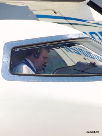 Learjet 45 (N445SE) - The Mantra of a good Pilot is the Checklist, here Co-Pilot of this Lear 45 is busy doing just that. Location is Grand Strand Airport (KCRE) in North Myrtle Beach, SC. Image date is 9/30/2015.