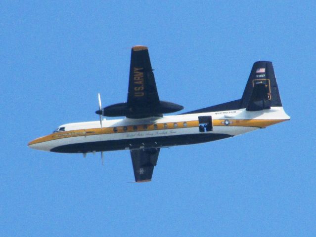 — — - U.S. Army sky diving plane over NHRA drag racing finals, Pomona, CA