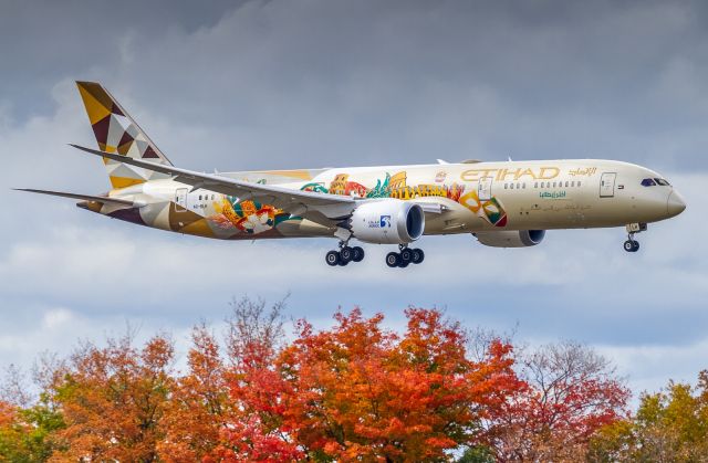 Boeing 787-9 Dreamliner (A6-BLH) - The ADNOC (Abu Dhabi National Oil Company) "Choose Italy" livery glides past some Autumn colours for a runway 05 touchdown at YYZ