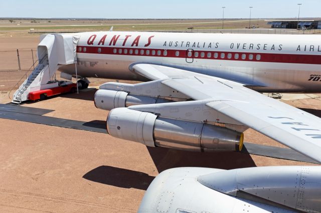 Boeing 707-100 — - Wing walking on a B707. The third engine, a JTD9 belongs to the B747-200 parked along side.