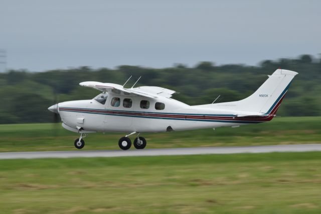 Cessna P210 Pressurized Centurion (N92CK) - Departing Runway 23 at FDK from AOPA Fly-In Saturday 5-11-2019 as rain showers began to near