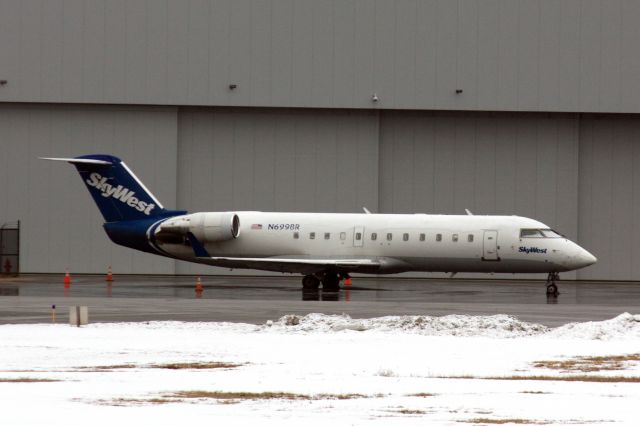 Canadair Regional Jet CRJ-200 (N699BR) - Sky West CRJ200 at Hanscom presumably doing a sports charter on 2/27/21. 