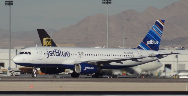 Airbus A320 (N590JB) - Taken on December 31, 2013. This Airbus A320 was taking off from runway 1 at Las Vegas McCarran Airport heading to Daugherty Field in Long Beach, California.