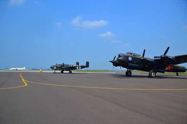 Avro 683 Lancaster (VRA) - A "Lancaster Bomber and a B25 Mitchell Bomber" getting ready to do a formation flyover CYQG.