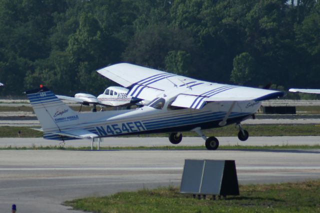 Cessna Skyhawk (N454ER) - Rough touchdown on runway 25R. Like my photos? Follow me on twitter: @nsandin88