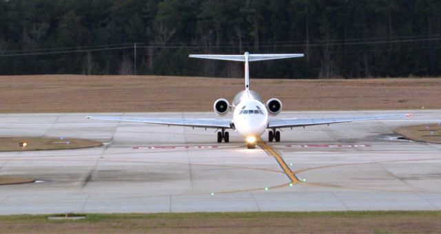 McDonnell Douglas MD-88 (N918DE) - A Delta McDonnell Douglas MD-88 landing at Raleigh-Durham Intl. Airport. This was taken from the observation deck on January 17, 2016 at 5:29 PM. This is flight 1774 from ATL.