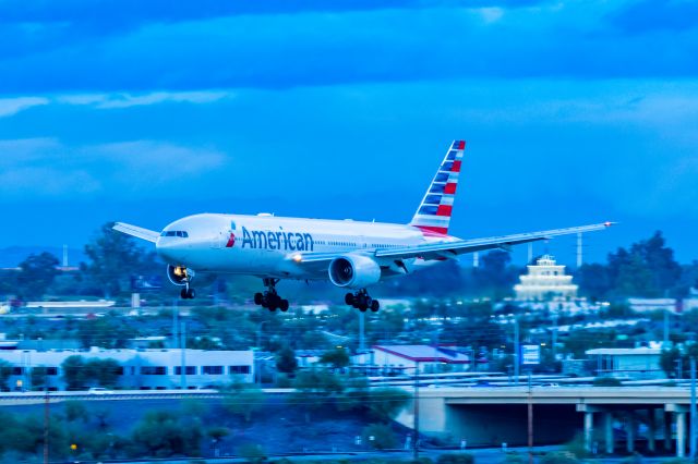 Boeing 777-200 (N757AN) - An American Airlines 777-200 landing on a cloudy morning at PHX on 1/17/23. Taken with a Canon R7 and Tamron 70-200 G2 lens.