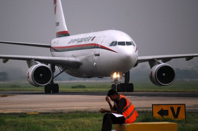 Airbus A310 (S2-ADK) - Ramp worker saying to himself, "Oh here comes Biman, only 16 hours late!"