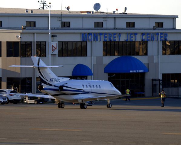 Hawker 800 (N770CC) - KMRY - Jet center ramp agents about to block-in 770CC at Monterey.